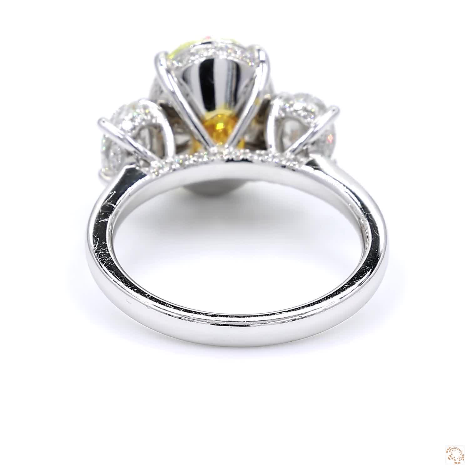 Three Stone Oval Fancy Yellow Diamond Engagement Ring